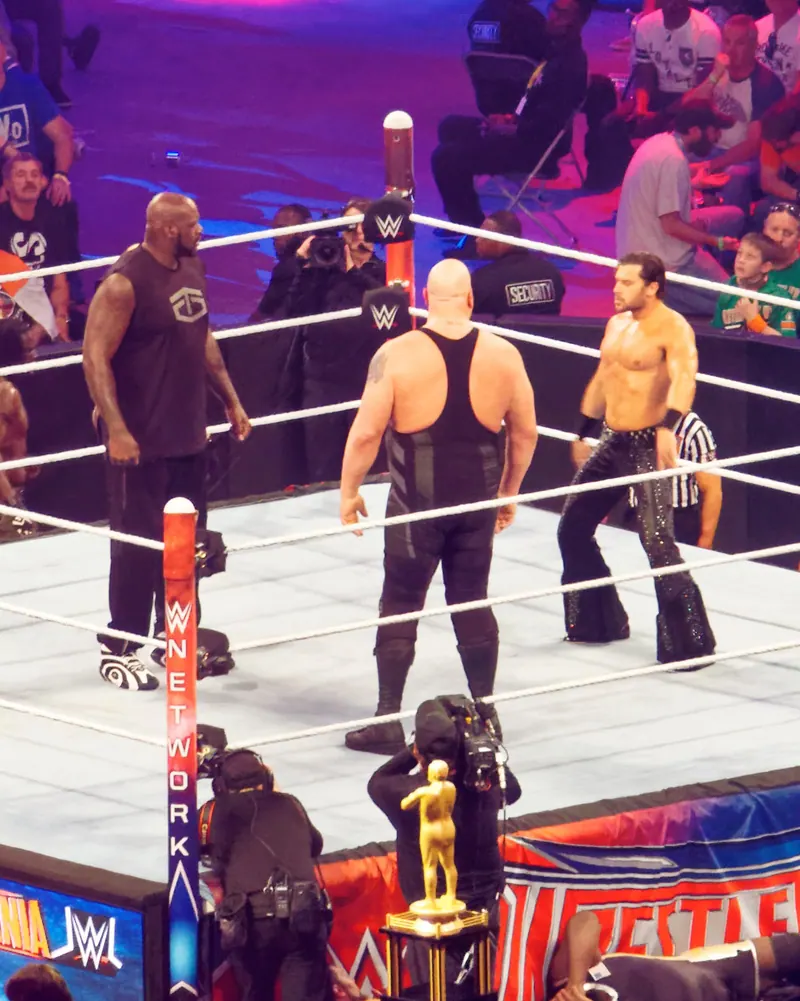 Shaquille O'Neal stands in the ring facing the Big Show during the Andre the Giant Memorial Battle Royal at WrestleMania 32, AT&T Stadium, Arlington, Texas.